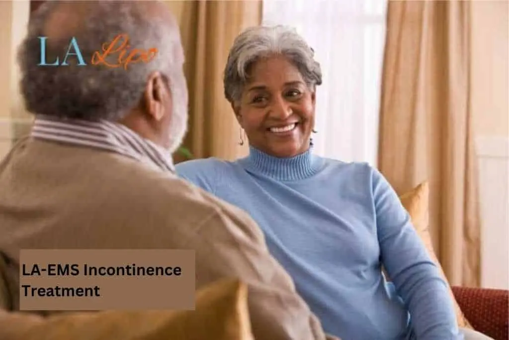 Couple sat smiling at each other - LA-EMS treatment Prestwich